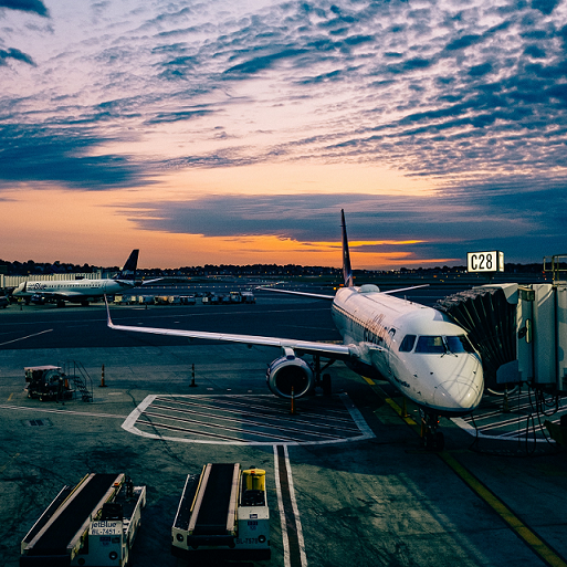 Plane at a terminal at twilight